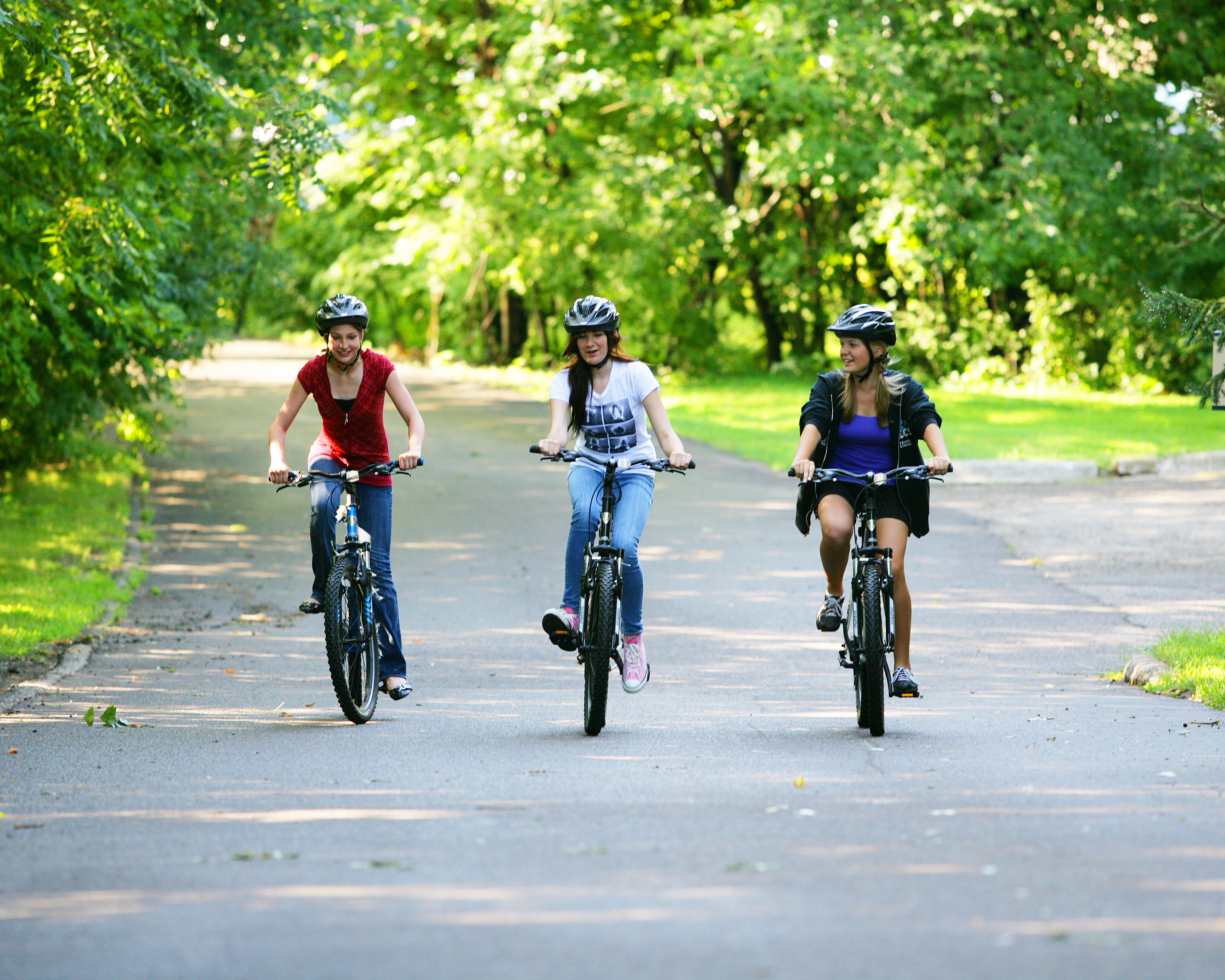 Three individuals enjoying the Plymouth bike path