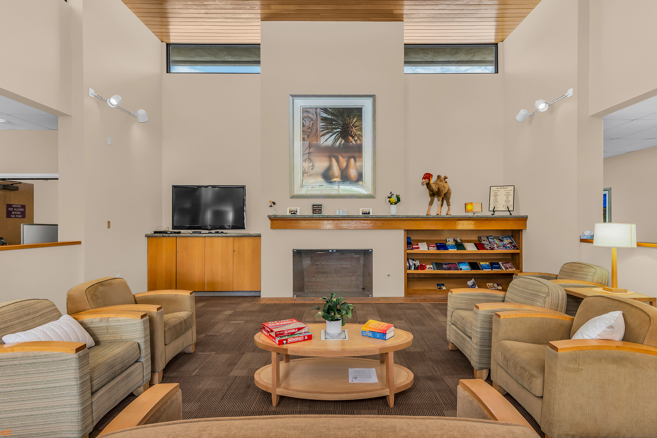 Inside a comfortable room with bookshelves and comfortable chairs