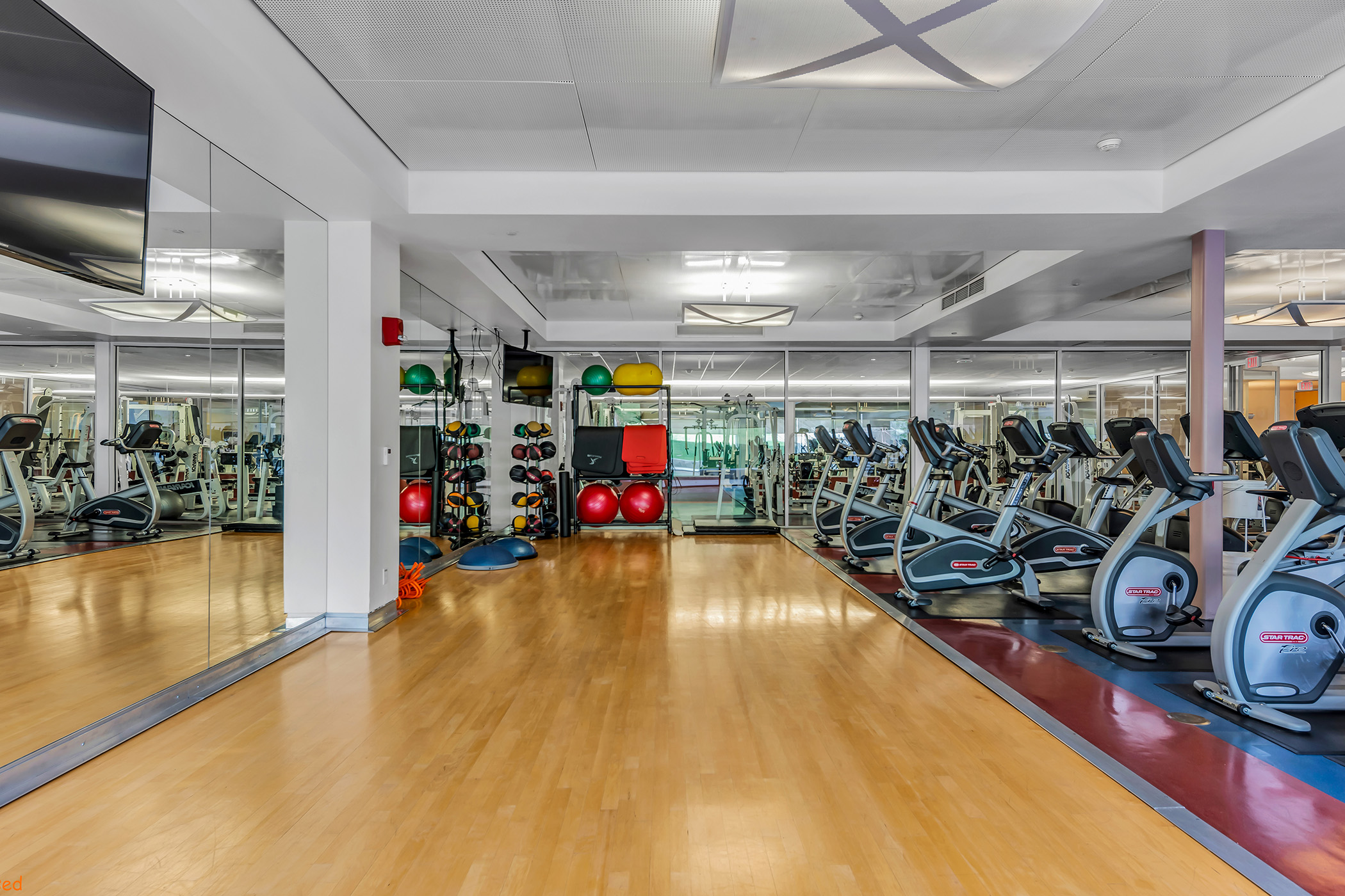 Inside a gym with weights and several exercise machines