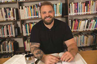 Matt Sassman in the Hazelden Betty Ford Graduate School of Addiction Studies library